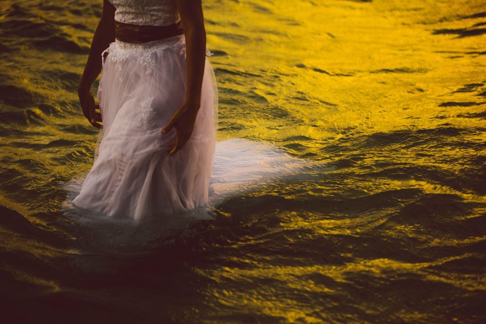 A bride swimming in the wedding gown